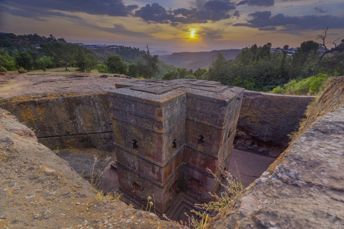 Evening light on the Church of Saint George and the surrounding rock trench in Lalibela